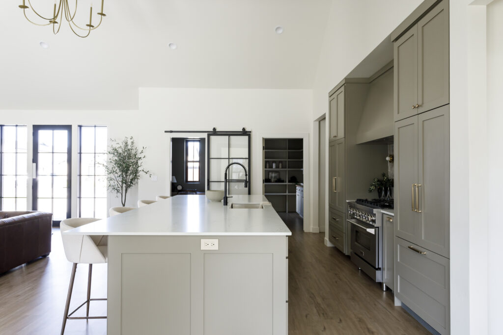 wide-seat barrel-shaped 26-inch upholstered counter stools in a custom kitchen in Twin Falls Idaho | Meg & Co