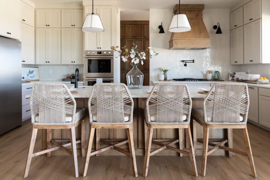 four Woven Rope Back Counter Stools at the countertop in a custom kitchen created by Meg & Co in Twin Falls Idaho