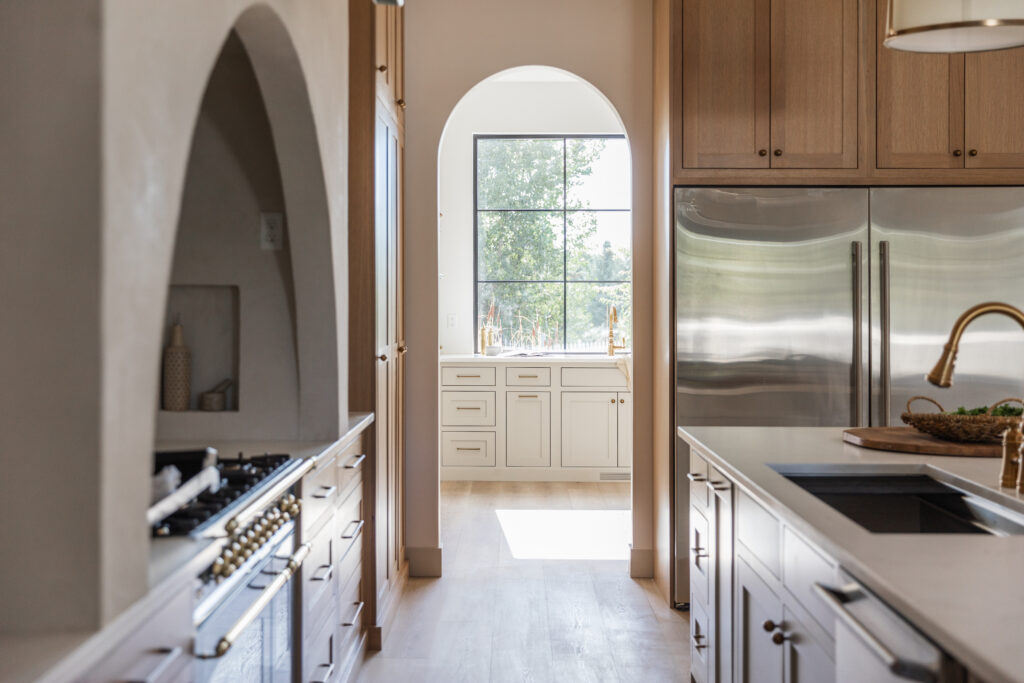 a view of a scullery kitchen from the main kitchen of the custom home in Twin Falls Idaho | Meg & Co