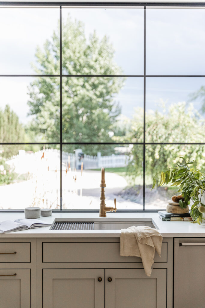 custom butler's pantry with a large window and plenty of natural light is a great design idea for your scullery kitchen or butler's pantry