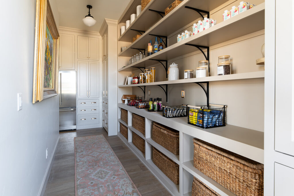 a butler's pantry in a custom home by Meg & co painted in one of the best interior paint colors that is neutral, called SW 9173 Shiitake by Sherwin Williams