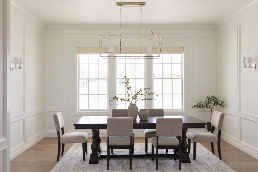 Our team at Meg & Co added Wainscoting Panels to this custom dining room design at our Clifford Project in Twin Falls 