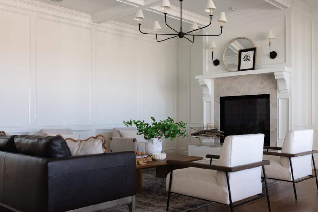 a pair of Fireplace Wall Sconces above the mantel in a formal living room, in a custom home designed and built by Meg & Co