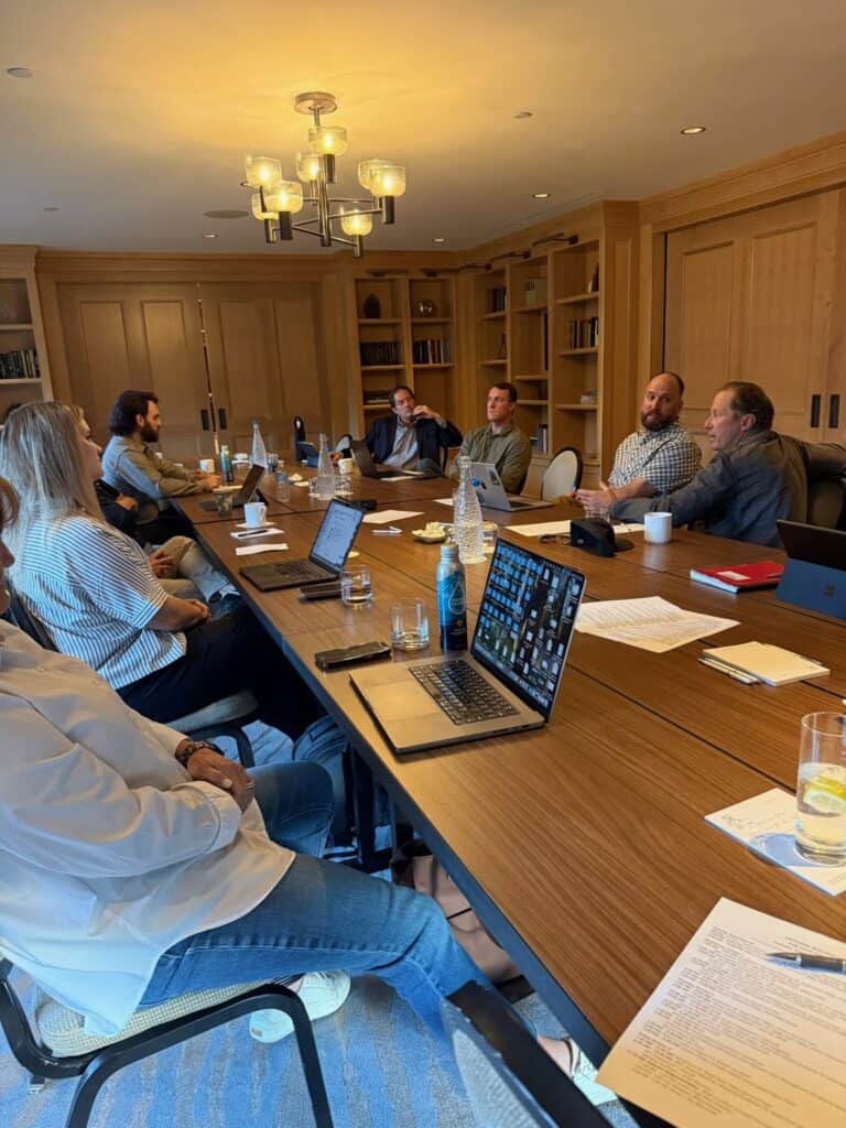 Meg Billings attending a work meeting with her builder colleagues during Artisan Builder Collective in Park City Utah 