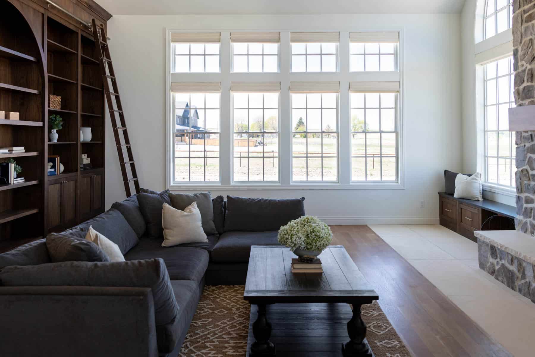 This inviting living area centers around a stunning two-story stone fireplace — the perfect backdrop for cozy nights and time spent with loved ones.