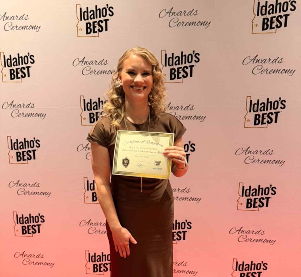 Meghan Billings holds Meg & Co. Designer Homes’ certificate at the 2026 Idaho’s Best Awards Ceremony.