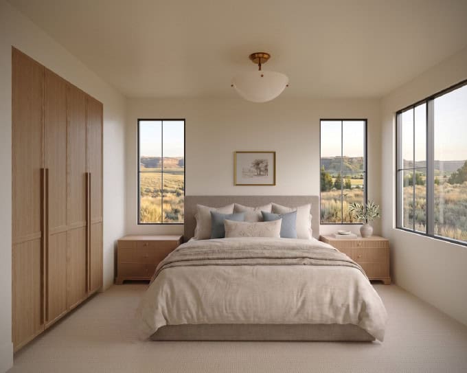 Bedroom With View - Custom Home Hailey Idaho Guest bedroom in The Merrick featuring custom wood cabinetry, expansive windows, and views of the surrounding Hailey, Idaho landscape.