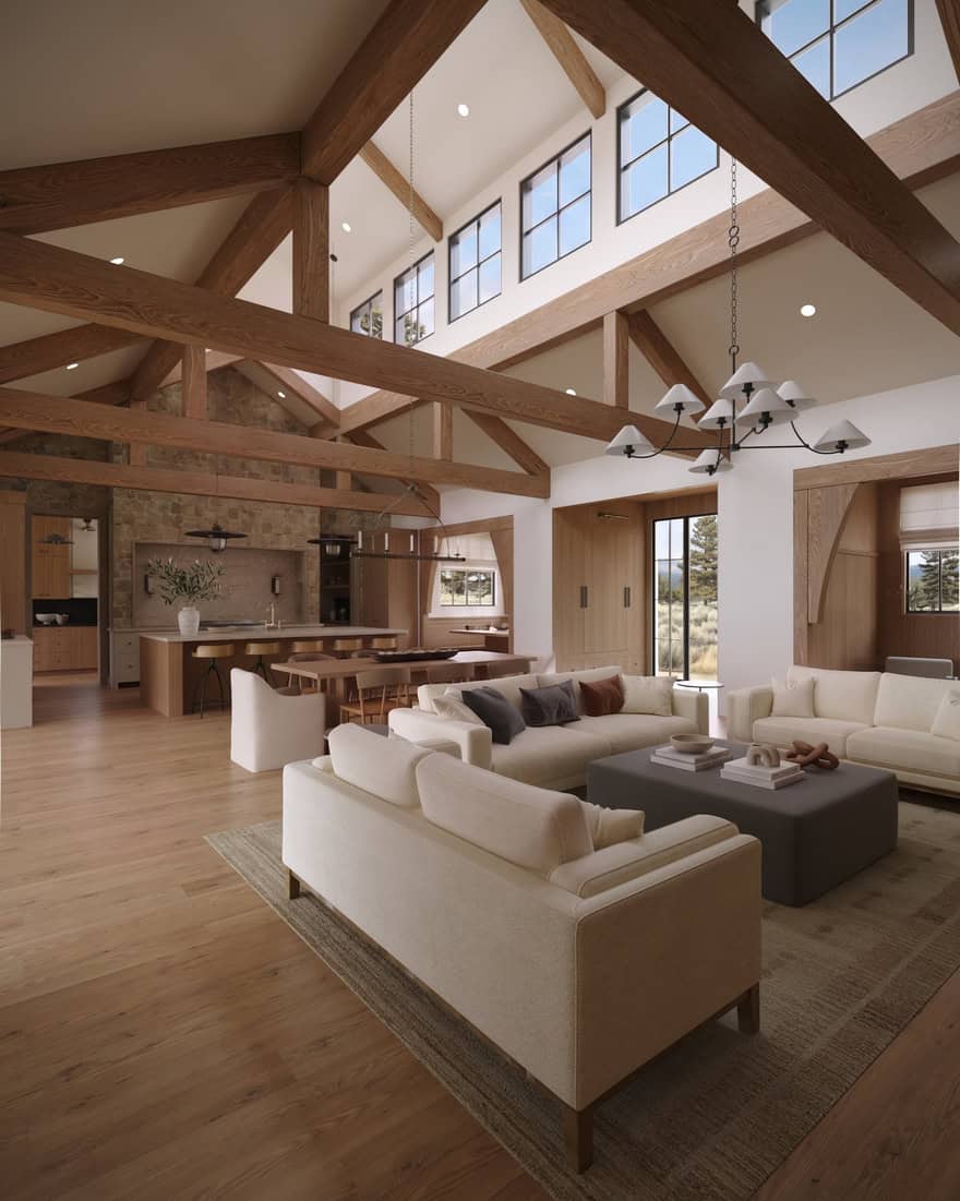 Great room in The Merrick featuring exposed timber beams, a dramatic stone fireplace, vaulted ceilings, and expansive windows.